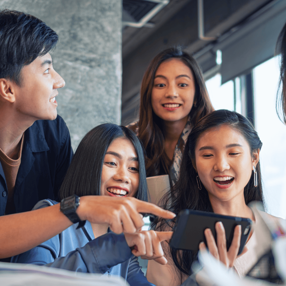 Group of friends watching video on a tablet 
