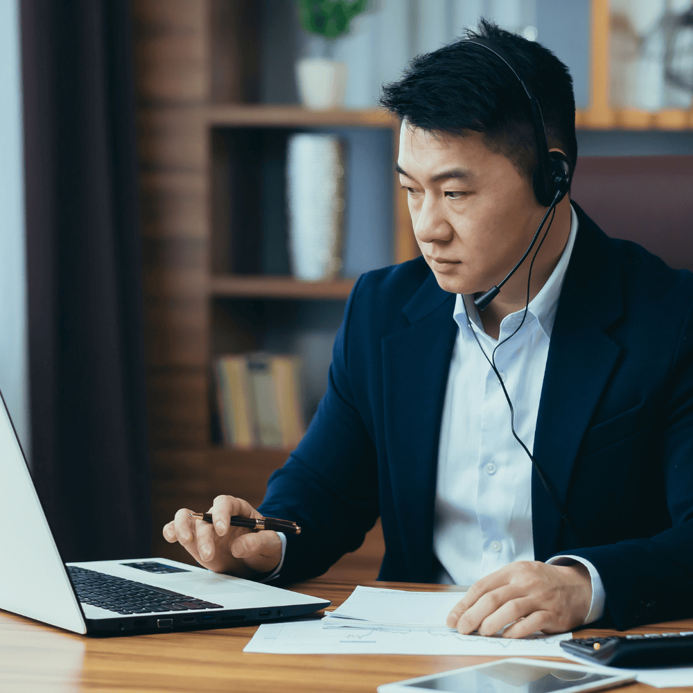 an employee giving support calls in office