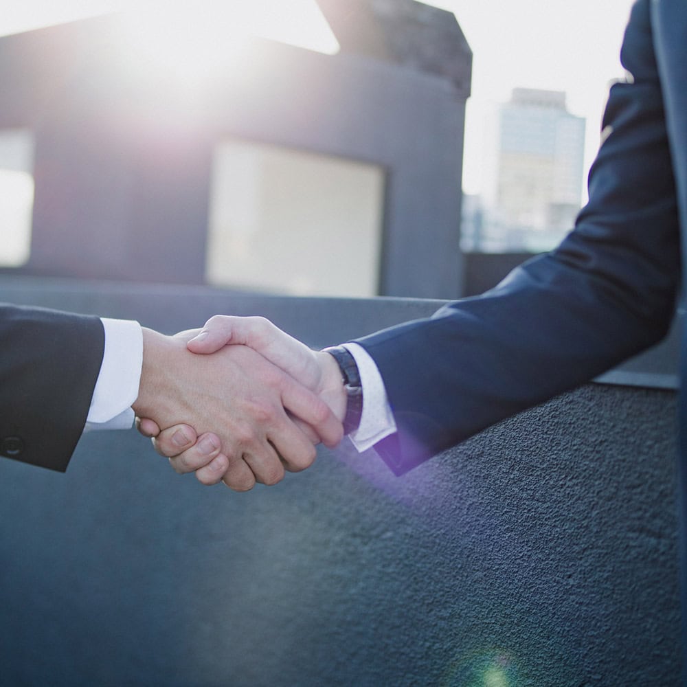 formal handshake picture in team building page